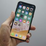 iPhone 17 Pro Max vs Samsung Galaxy S26 Ultra: Camera, Battery & AI Compared person-holding-smartphone