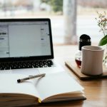 Person learning on laptop at home with online course interface