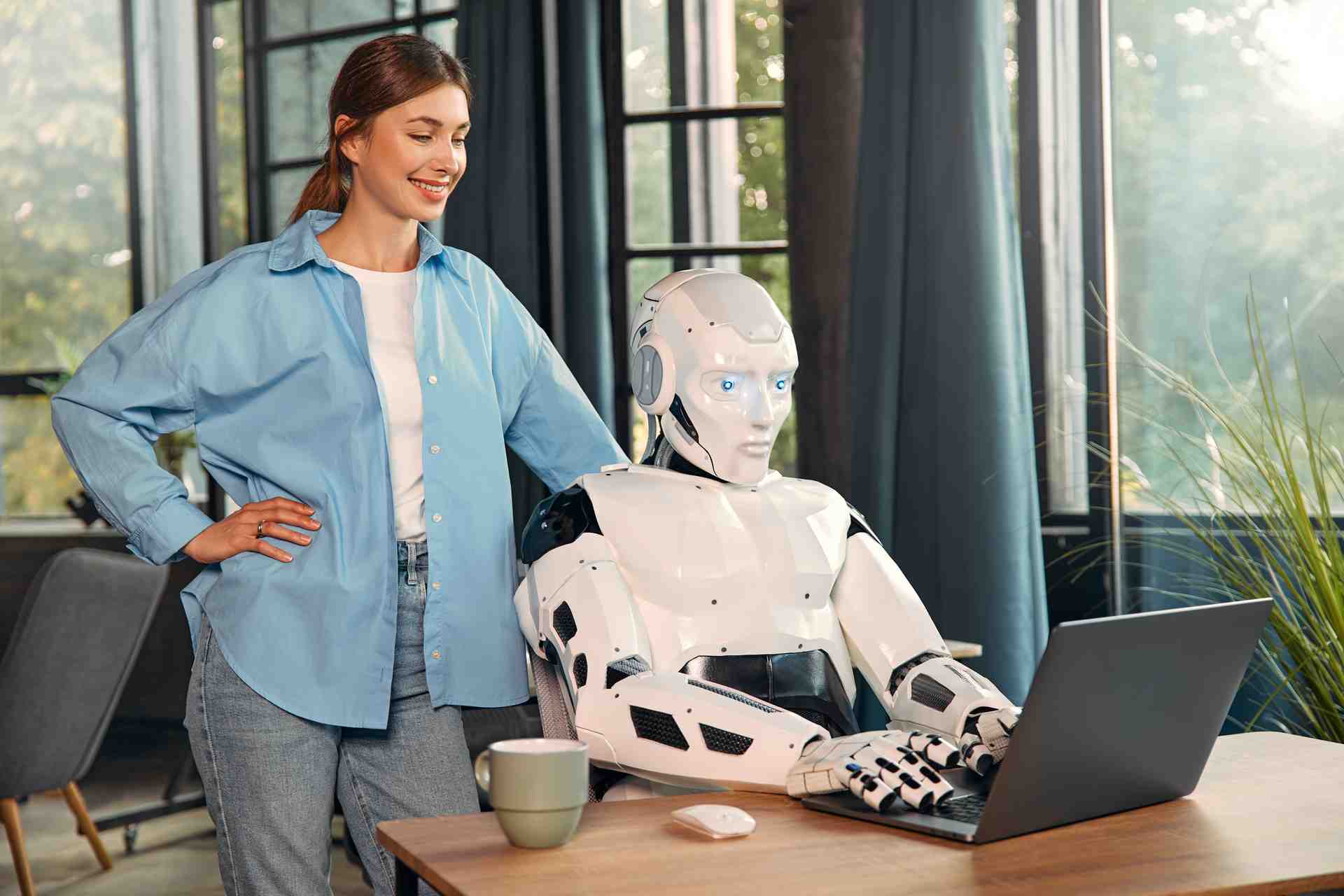 robot-and-woman-working-on-laptop-in-office-2026-03-24-15-27-27-utc